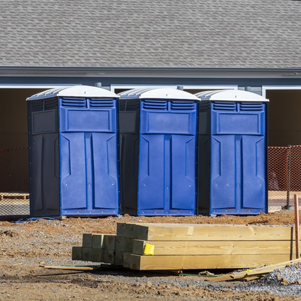 what is the cost difference between standard and deluxe portable toilet rentals in Amwell